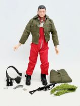 A vintage Palitoy Action Man figure with accessories.