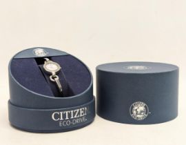 A ladies Citizen Eco-Drive watch in original box