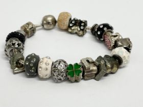 A bracelet with some silver charms.