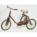 A vintage child’s Triang tricycle.