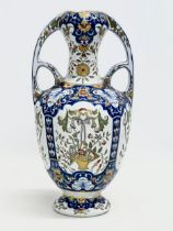 A late 19th century North European hand painted ceramic pot with 2 handles. 16x32cm