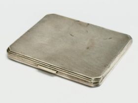 A silver cigarette case. 121 grams.