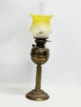 A tall Victorian brass oil lamp. 71cm