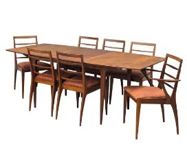 A McIntosh Mid Century teak extending dining table with a set of 7 chairs designed by Tom