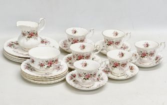 A 23 piece Royal Albert ‘Lavender Rose’ tea service. 4 salad plates, milk jug, sugar bowl, 5