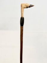A large vintage hiking stick with taxidermy deer foot. 143cm