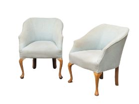A pair of good quality vintage tub chairs.