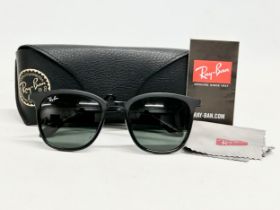 A pair of Ray Ban ‘Luxottica’ sunglasses with case.