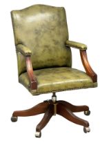 A good quality Gainsborough style leather swivel desk chair with brass studs.