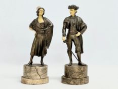 A pair of 1930’s Art Deco spelter and faux ivory figures on marble bases. 26.5cm