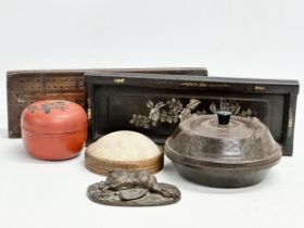 A sundry lot. A 1930’s Bakelite powder box. An early 20th century Japanese red lacquered box. A