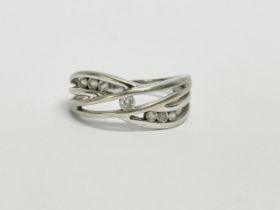 A ladies white gold and diamond ring. PJD Jewellers. 3.44 grams. Size N.