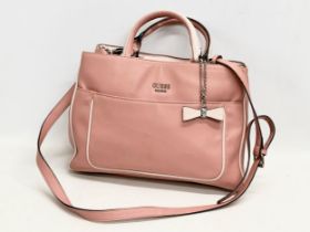 A ladies leather handbag by Guess.