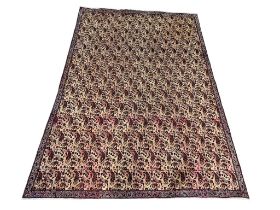 A very large vintage Middle Eastern style hand knotted rug. 324x223cm