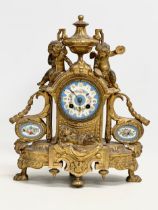 A mid 19th century Henry Marc gilt brass mantle clock, decorated with cherubs and hand painted