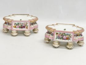 A pair of late 19th century hand painted porcelain stands. 20x13x9cm