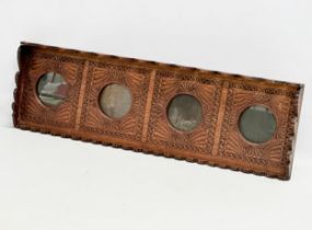 A large late 19th century carved teak wall hanging picture frame. Circa 1880. 71x5x21.5cm