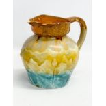 A 1930’s English Art Deco glazed pottery jug. 18x21x19cm