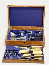 A large good quality vintage oak cased cutlery set. 45x30x12cm