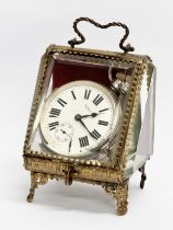 A large Waltham silver pocket watch (1915) and an ornate late 19th century brass display case.