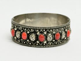 An ornate Italian silver bangle. Stamped Alp, Italy. 6.5x6cm