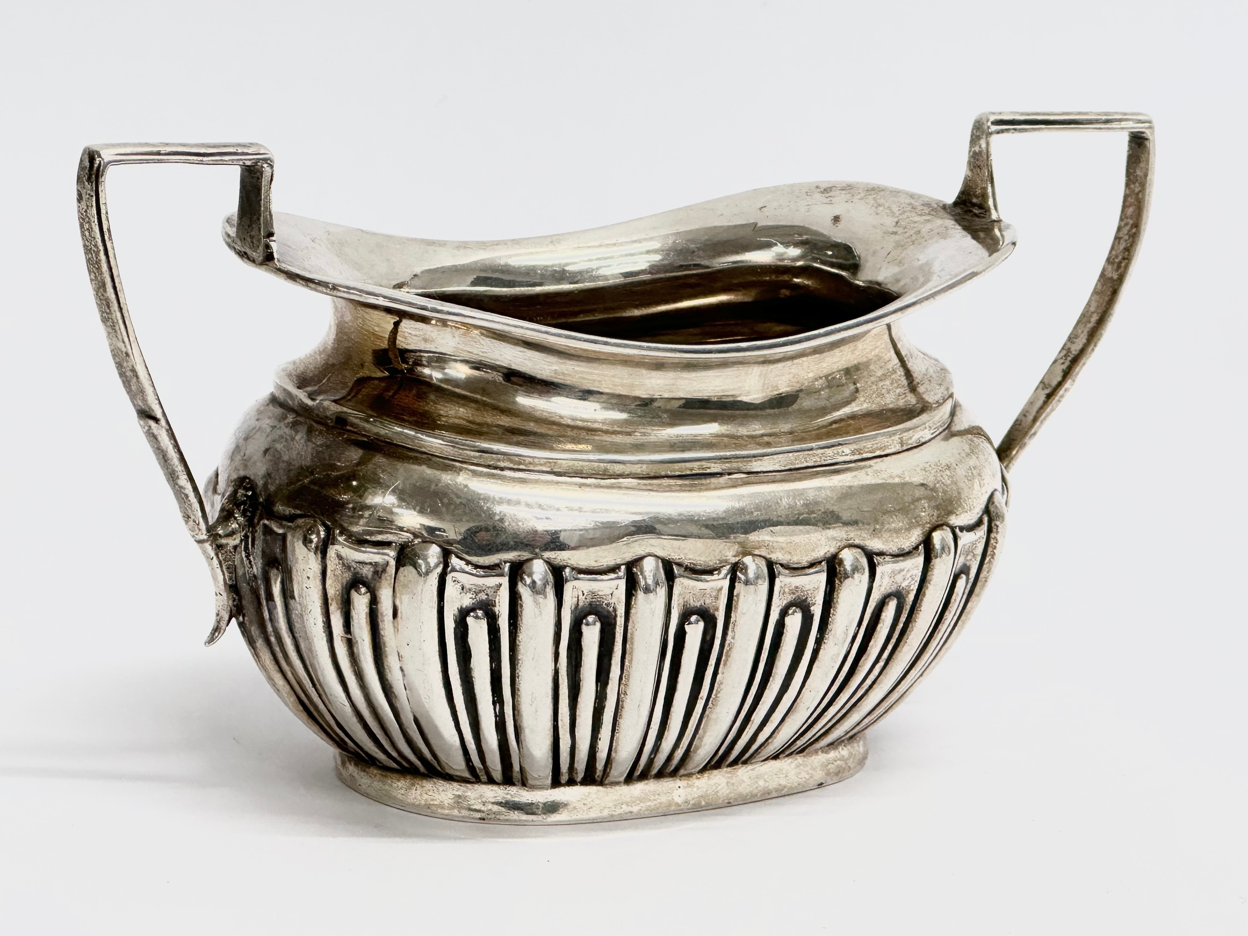 A late 19th century silver sucrier and matching cream jug by James and William Deakin. Circa 1894- - Image 2 of 2