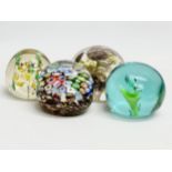 A late 19th/early 20th century glass dump paperweight and 3 others. A vintage millefiori paperweight