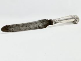 A late 19th century silver handled carving knife by Harrison Brothers & Howson. Sheffield, 1896.