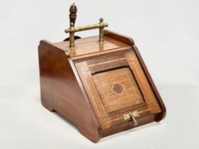 A late Victorian inlaid mahogany coal scuttle in the Aesthetic Movement. 33.5x49x40cm