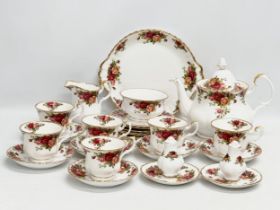 A 26 piece Royal Albert ‘Old Country Roses’ tea service. Teapot 25x15x20cm. 6 cups and 6 saucers.