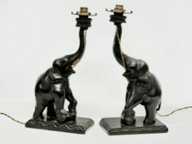 A pair of large early/mid 20th century carved ebonised teak elephant table lamps. 21x12x42cm