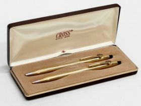 A pair of Cross pens with case.