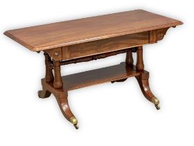 A George IV mahogany cut down library table with drawer and brass cup casters. Circa 1820.