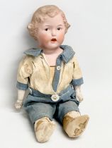 An early 20th century Heubach bisque doll. Circa 1910-1920. 24cm