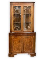 A George III style mahogany corner cabinet. 92x50x180cm