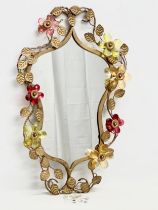 A 1950’s gilt wrought iron framed mirror with coloured cut glass flowers. 36x57cm