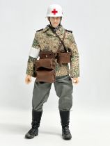 A Dragon Models LTD WWII German Medic action figure. 31cm