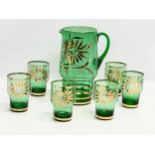 A 1970’s Mid Century Bristol Green and gilt drinks set. Jug measures 17x11.5x24cm. Glasses 7x10.5cm