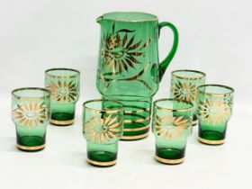 A 1970’s Mid Century Bristol Green and gilt drinks set. Jug measures 17x11.5x24cm. Glasses 7x10.5cm