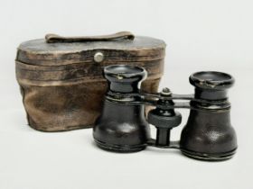 A pair of vintage Field Glasses with original case. 10.5x7.5cm extended.