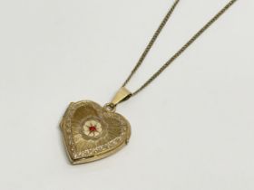 A vintage rolled gold locket necklace. 24cm closed.