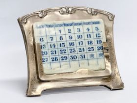 A early 20th century Mappin & Webb silver desktop calendar. Circa 1922-1937. 12x10cm
