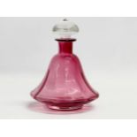 A mid 20th century Cranberry Glass decanter. 14x19cm