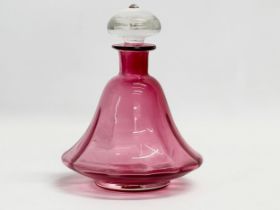 A mid 20th century Cranberry Glass decanter. 14x19cm