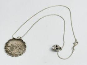 A vintage silver Chinese style necklace with silver skull. 10.40 grams total. 26cm closed.