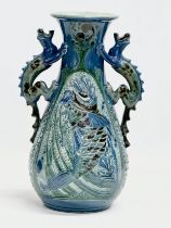 An early 20th century C.H. Brannam Barum Ware glazed pottery vase designed by Frederick Bowden.