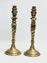 A pair of large Victorian brass candlesticks. 35cm