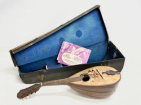 A late 19th/early 20th century Francesco Perretti & Figli mandolin with case.