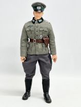 A Dragon Models LTD WWII German officer action figure. 32cm