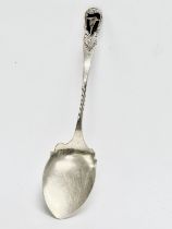 An early 20th century Joseph Cook & Son silver spoon with Irish Harp and clover decoration.